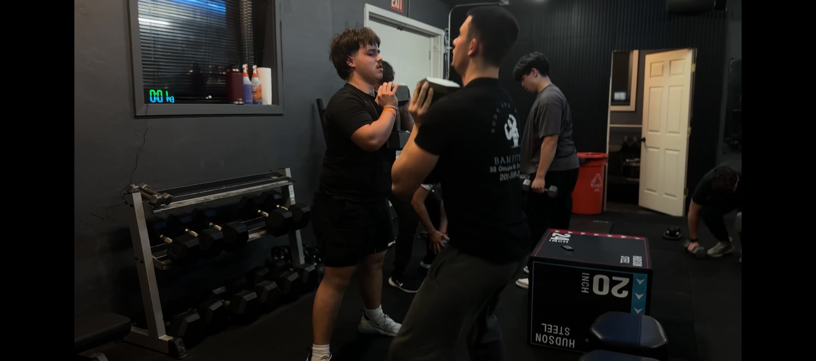 Partners training together with focus mitts at BAM Fitness in Dumont, NJ